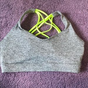 Grey and neon yellow strappy sports bra